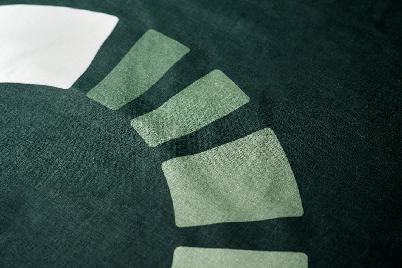 The logo segments, up close, on woven hemp